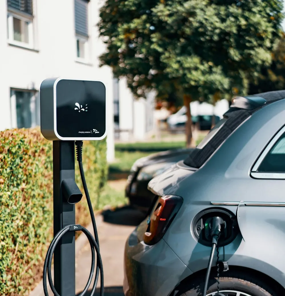 An electric vehicle connected to a charging point